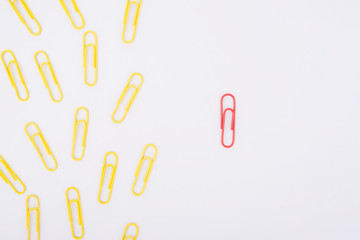 Different concept. A separate paper clip indicates a different direction as a team guide. Business concept.