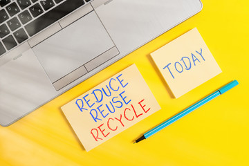 Text sign showing Reduce Reuse Recycle. Business photo text environmentallyresponsible consumer behavior Trendy silver open laptop square sticky notepads marker colored background