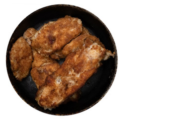 Fototapeta na wymiar Fried chicken slices in breadcrumbs