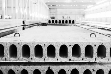 Stack of precast reinforced concrete slabs in factory workshop