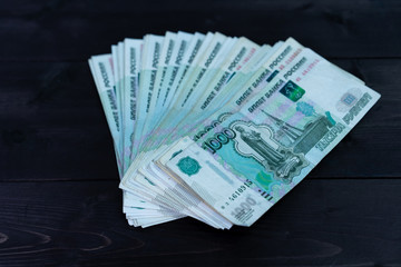 Bundle of money on wooden background
