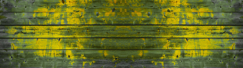 Yellow green Abstract scratched painted exfoliated peeled wooden boards wall texture Background...