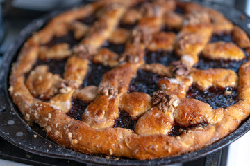 Sweet cake with jam and nuts