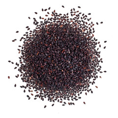 Heap of black sesame seeds isolated on a white background. Top view. 