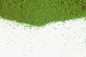 Heap of powdered matcha tea isolated on a white background. Top view.