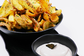 crispy fried potato chips or wedges with truffle cream dip