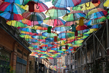 Background colorful rainbow different color umbrellas. unban tourist street decoration. Istanbul, Karakoy © olga_demina