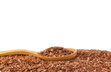 Flax seeds on a wooden spoon isolated with copy space for text.