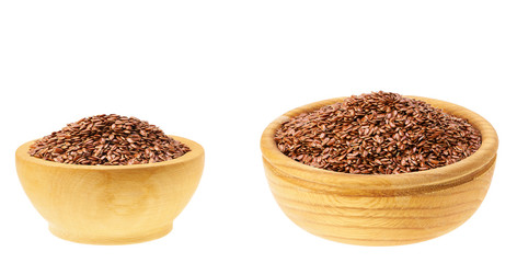 flaxseed in a wooden bowl  isolated on a white background.