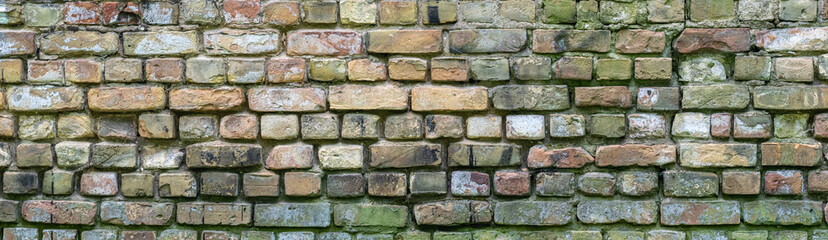 brick wall of dirty yellow color, wide panorama of masonry. old rough brick wall.