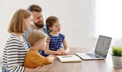 Family listening to online doctor.