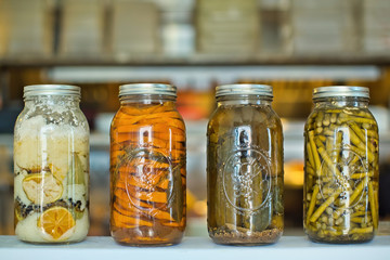 Jars of homemade canned vegetables and pickles