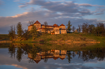 Naklejka na ściany i meble Ancient Svirzh castle at sunset in april 2020. Svirzh village, Lviv region.