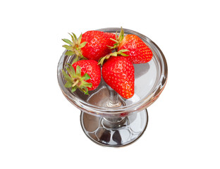 Fresh Slovenian strawberries on a glass form on a wooden table