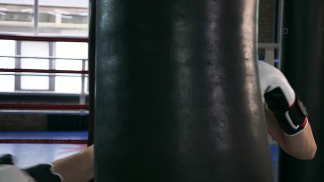 4K 60p Caucasian Male Boxer Training at Urban Gym. Practicing Hits on Punch Bags Pads