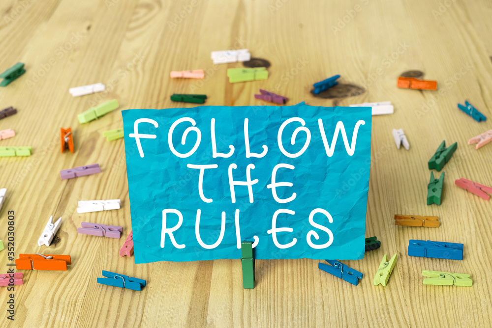 Poster writing note showing follow the rules. business concept for go with regulations governing conduct or