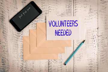 Conceptual hand writing showing Volunteers Needed. Concept meaning need work or help for...