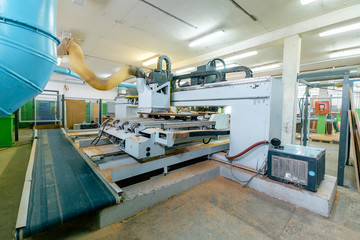 Machine tools in the furniture factory. Wooden furniture production. Joinery.