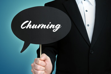 Churning. Lawyer (Man) holds the sign of a speech bubble in his hand. Text on the label. Symbol of...