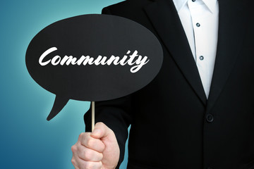 Community. Lawyer (Man) holds the sign of a speech bubble in his hand. Text on the label. Symbol of...