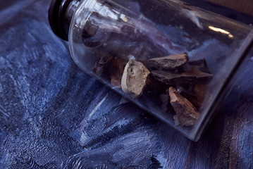 glass jar with various rare stones