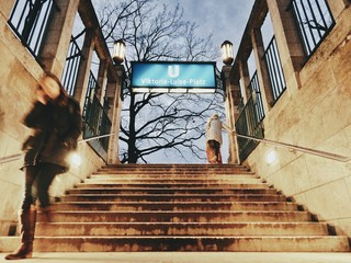 Obraz na płótnie Canvas Low Angle View Of Woman Walking On Stairs