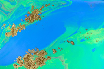 Blue and green ocean abstract background. Liquid marble pattern with gold powder.