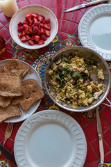 top view of Spanish style table with a Vegan breakfast with tofu egg scramble and diary free french toast dipped in almond milk