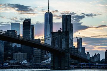 New York night panorama. Brooklyn Bridge and New York City skyline. Manhattan skyline. Skyscrapers buildings. New York City night lights. 