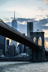 New York night panorama. Brooklyn Bridge and New York City skyline. Manhattan skyline. Skyscrapers buildings. New York City night lights. 