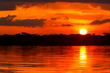 Fototapeta na wymiar dramatic red sky in amazonian jungle ecuador