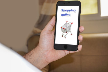 man holding mobile phone with shopping online icon