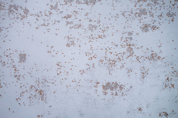 wood plywood surface with chipping white paint