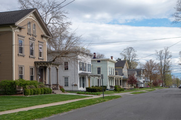 day sky and street with suburban homes