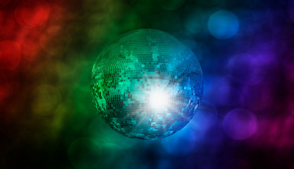 Party disco mirror ball reflecting purple lights