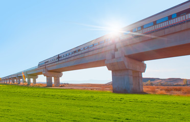 High-speed train crossing a viaduct