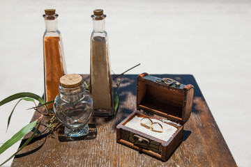 Wedding rings close up decorated nautical with accessories for tropical caribbean outdoor wedding ceremony on the sandy beach in Dominican republic, Punta Cana