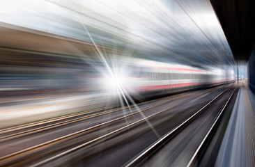 Fototapeta na wymiar High speed train runs on rail tracks . Train in motion 