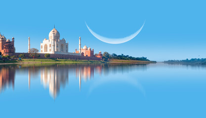 Taj Mahal mausoleum reflected in Yamuna river with crescent - Agra, Uttar Pradesh, India
