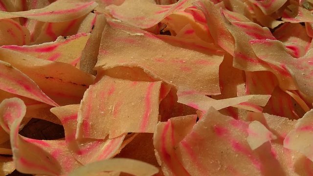 Raw cassava chips. Indonesia (Javanese) called it as opak telo. Traditional chips made off cassava. The taste is crunchy, savory, tasteful and delicious.