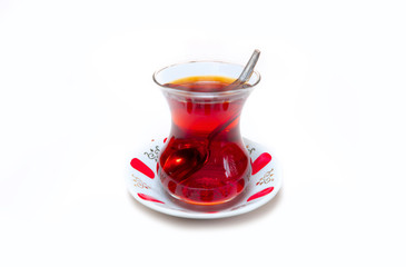 Glass of Turkish tea isolated on white background