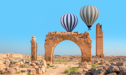 Hot air balloon flying over spectacular Mesopotamia with full moon - Ruins of the ancient city of...
