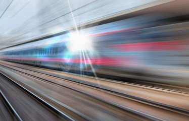 Fototapeta na wymiar High speed train runs on rail tracks . Train in motion 