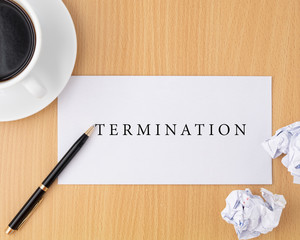 Businessman sending termination letter to boss on wooden table with pen and cup of coffee, Change of job, Unemployment and resign concept