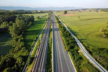 Fototapeta na wymiar Aerial view, railway and road in rural landscape .