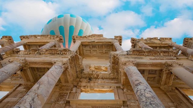 Hot air balloon flying over Celsus Library, Ephesus - Selcuk, Turkey