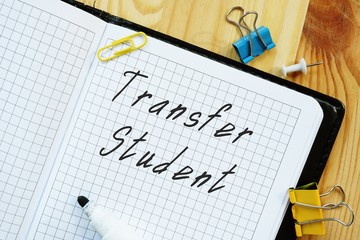 Business concept meaning Transfer Student with phrase on the piece of paper.