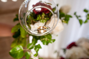 Wedding rings close up decorated nautical with accessories for tropical caribbean outdoor wedding ceremony on the sandy beach in Dominican republic, Punta Cana