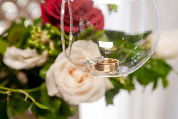 Wedding rings close up decorated nautical with accessories for tropical caribbean outdoor wedding ceremony on the sandy beach in Dominican republic, Punta Cana