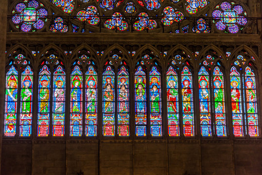 Stained patterns on glass of the window in the Notre-Dame de Paris before the big fire, a medieval Catholic cathedral on the Ile de la Cite in the 4th arrondissement of Paris